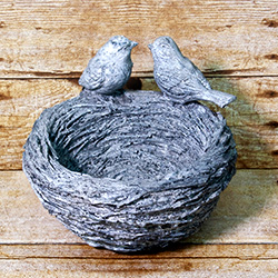 This planter brings a lovely natural aesthetic though the birds may wonder how your plant managed to take over their nest.
