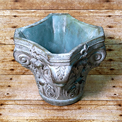 Bring a sense of nobility to your indoor garden with this planter resembling a column's echinus.