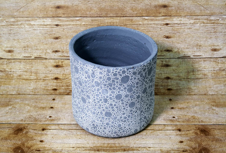 Modern and artsy, this planter will dedicate any plant in your collection as a chic accent piece.