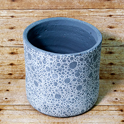 Modern and artsy, this planter will dedicate any plant in your collection as a chic accent piece.